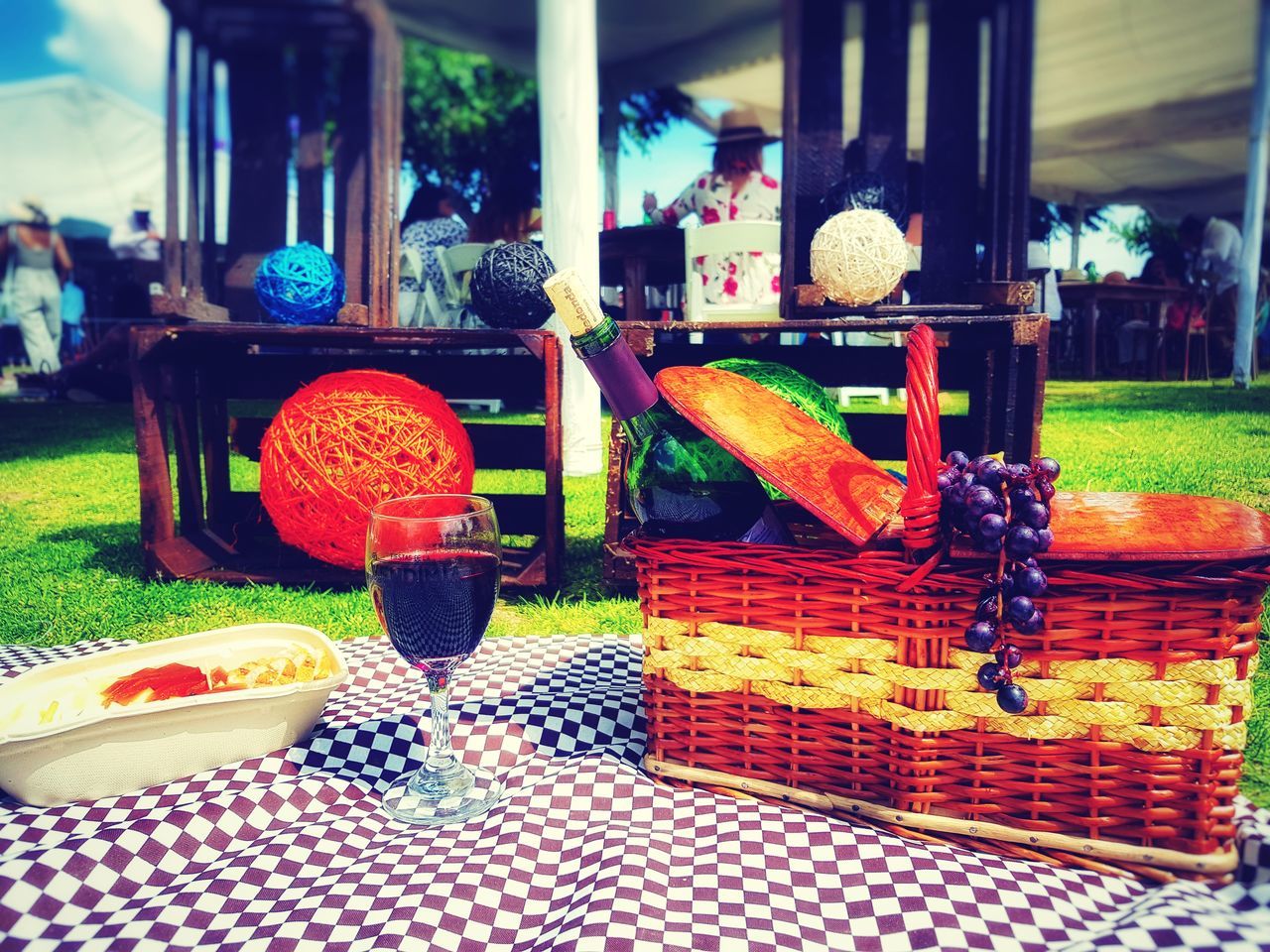 food and drink, no people, table, glass, food, drink, refreshment, day, alcohol, freshness, outdoors, still life, glass - material, red, close-up, fruit, built structure, healthy eating, focus on foreground