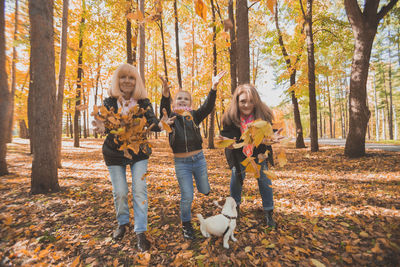 Two women in forest during autumn