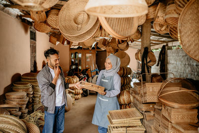 Rear view of man preparing food for sale