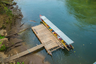 High angle view of boat by pier on lake