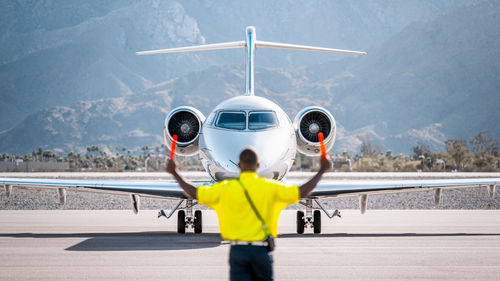 Rear view of man standing on street