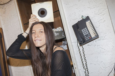 Young woman browsing albums in a record store