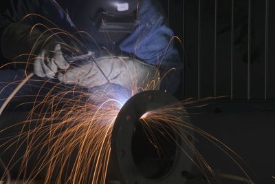 Blurred motion of man standing by metal structure