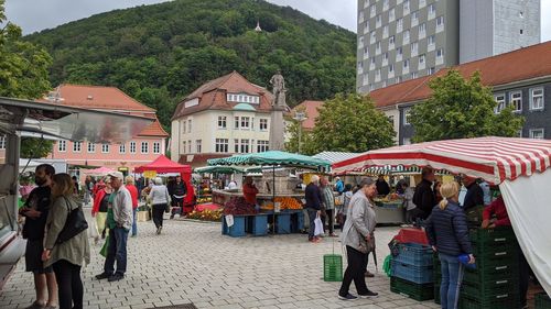 People at street market in city