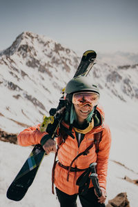 Portrait of man standing on snow