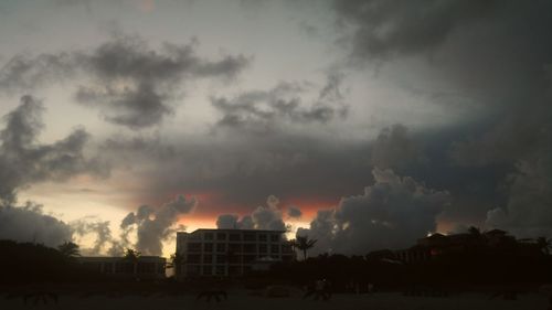 Buildings against sky at sunset