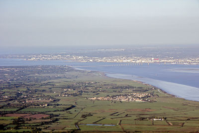 Aerial view of agricultural field against sky