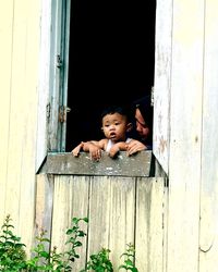 Portrait of boy peeking