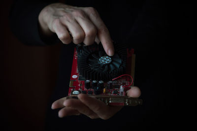 Close-up of a hand holding camera