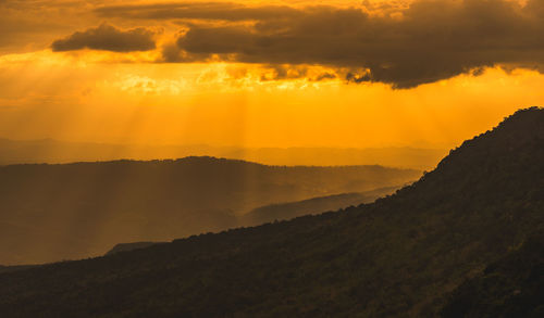 Scenic view of dramatic sky during sunset