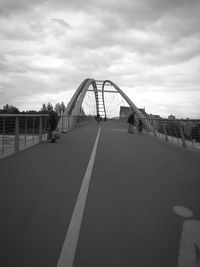 Bridge over city against sky