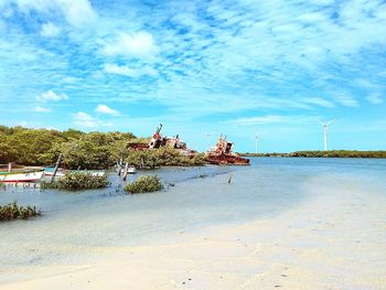 Scenic view of sea against cloudy sky