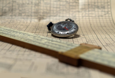 High angle view of clock on table