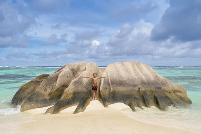 Famous granite boulders in blue lagoon on amazing  tropical beach, la digue island, seychelles