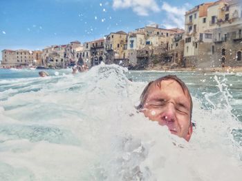 Man swimming in water