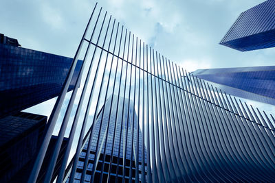 Low angle view of modern buildings against sky
