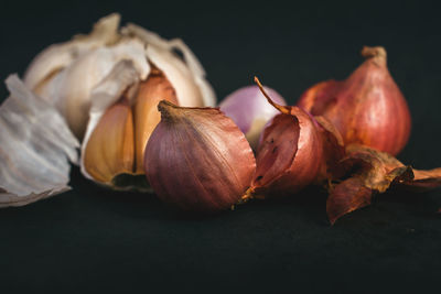 Close-up of fresh vegetables on table against black background