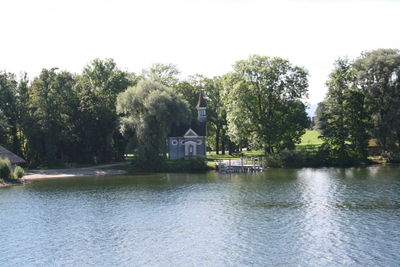 Scenic view of calm lake against clear sky