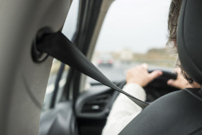 Woman in car with safety belt