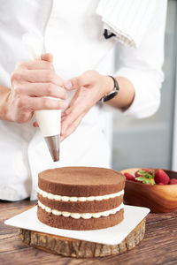 Midsection of woman preparing food