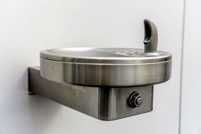 Close-up of faucet in bathroom