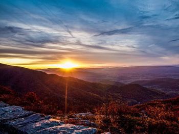 Scenic view of mountains against sky during sunset