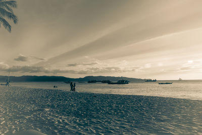 Scenic view of beach against sky during sunset