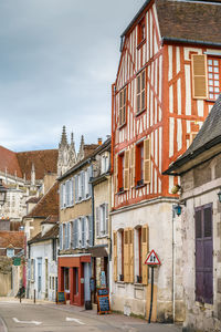 Buildings in city against sky