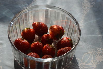 Close-up of strawberries in glass bowl on table