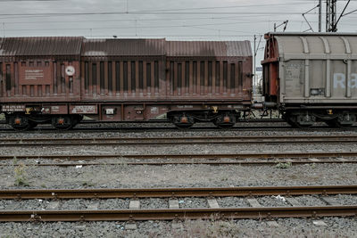 Train on railroad tracks against sky