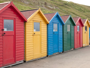 Colorful beach huts in row