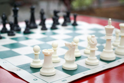 Close-up of chess pieces on table