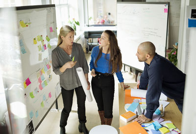 Business people discussing in creative office