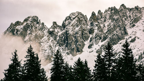 Scenic view of snow covered mountains against sky