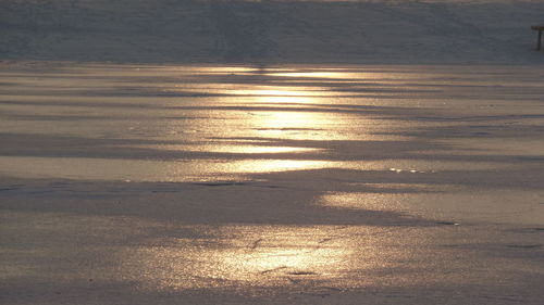 Scenic view of snow during sunset