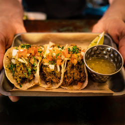 Cropped hand of person preparing food