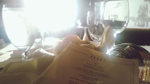 Close-up of open book on table in restaurant