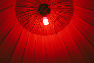 Low angle view of red illuminated lighting equipment