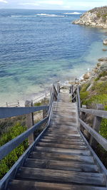 High angle view of wooden staircase at beach