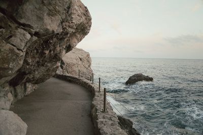 Walkway along cliffs by sea