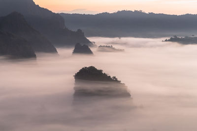 Scenic view of mountains against sky during sunset