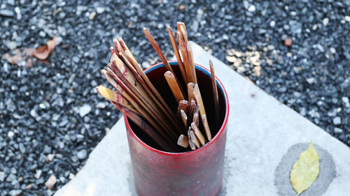 High angle view of multi colored pencils in container