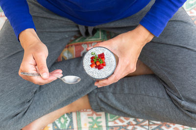 Vegan healthy eating and dieting food concept. female hands holding chia pudding