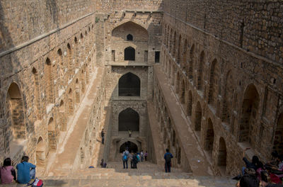 People in front of historic building