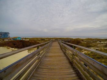 Walkway against sky