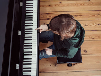 Directly above shot of man playing piano