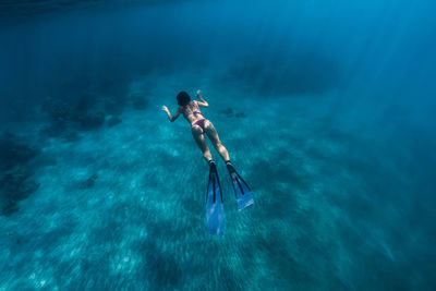 High angle view of man swimming in sea