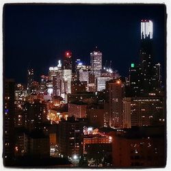 Illuminated cityscape at night