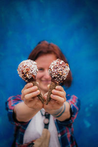 Close-up of hand holding ice cream