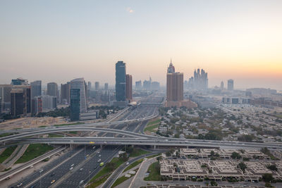 High angle view of city buildings during sunset